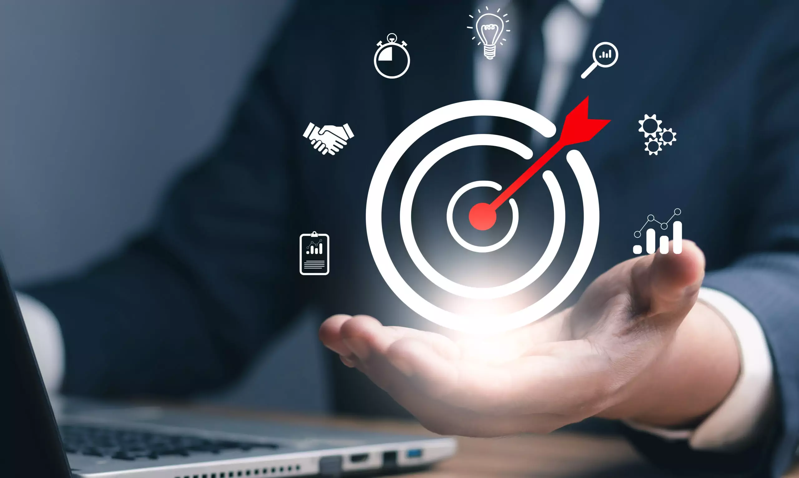 Business professional holding a digital target with a red arrow, surrounded by strategy, analytics and performance icons.